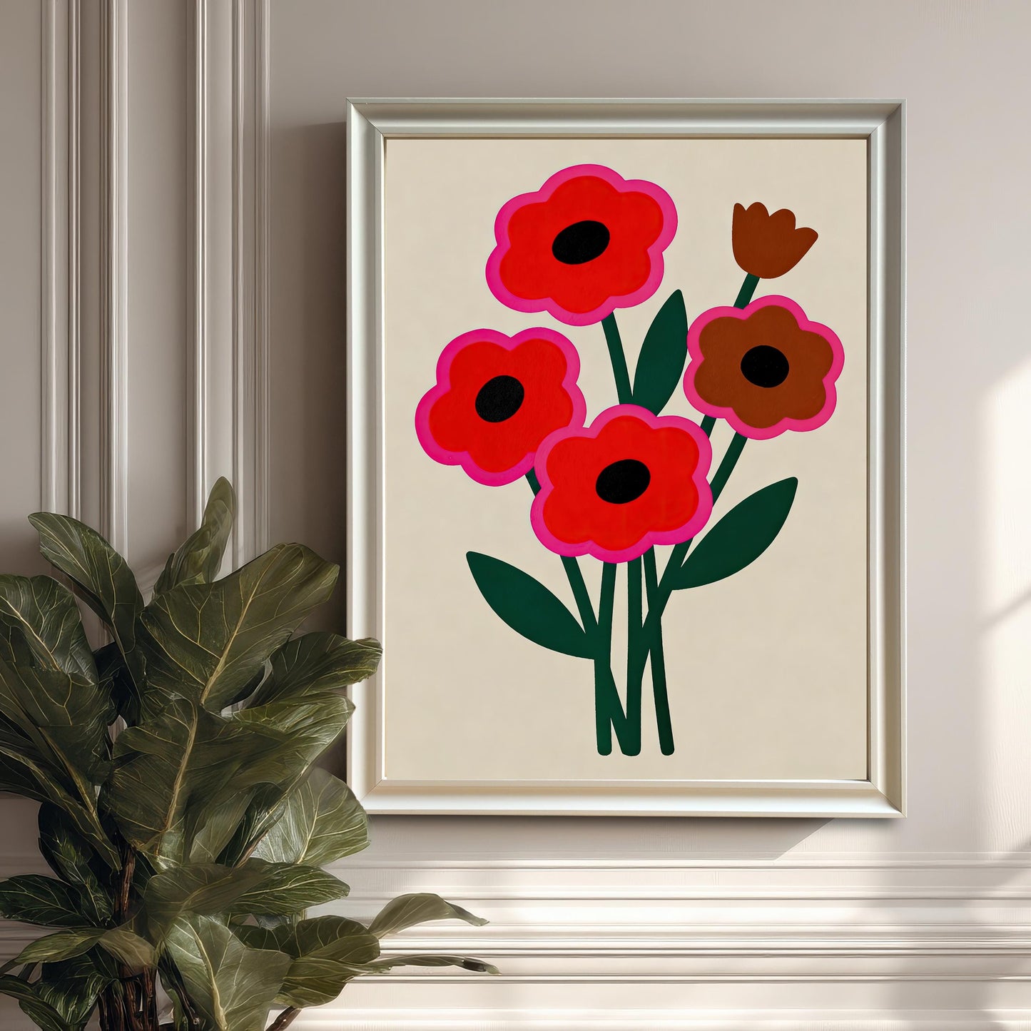 An abstract floral painting with red and brown flowers in a silver-colored frame hangs on a paneled white wall next to a large potted plant.