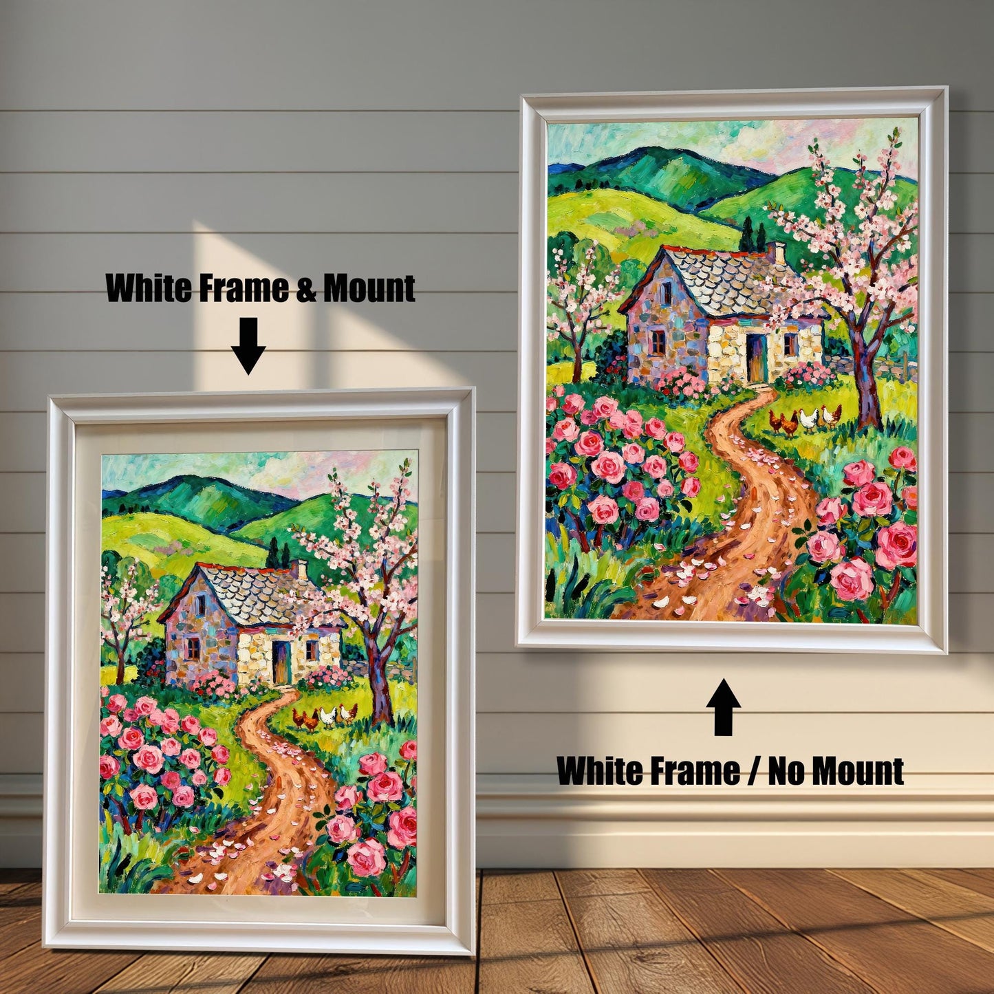 A side-by-side comparison of two white-framed prints of a vibrant cottage painting. The smaller one on the left has a mount (matting), while the larger one on the right has no mount.