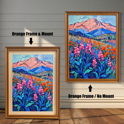 A side-by-side comparison of two orange-framed prints of a vibrant oil painting. The print on the left is smaller with a mount (matting), while the larger one on the right has no mount.