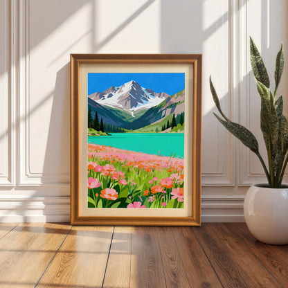 A framed painting of a bright mountain and lake scene. The frame is propped against a white wainscoted wall next to a potted snake plant on a wooden floor.