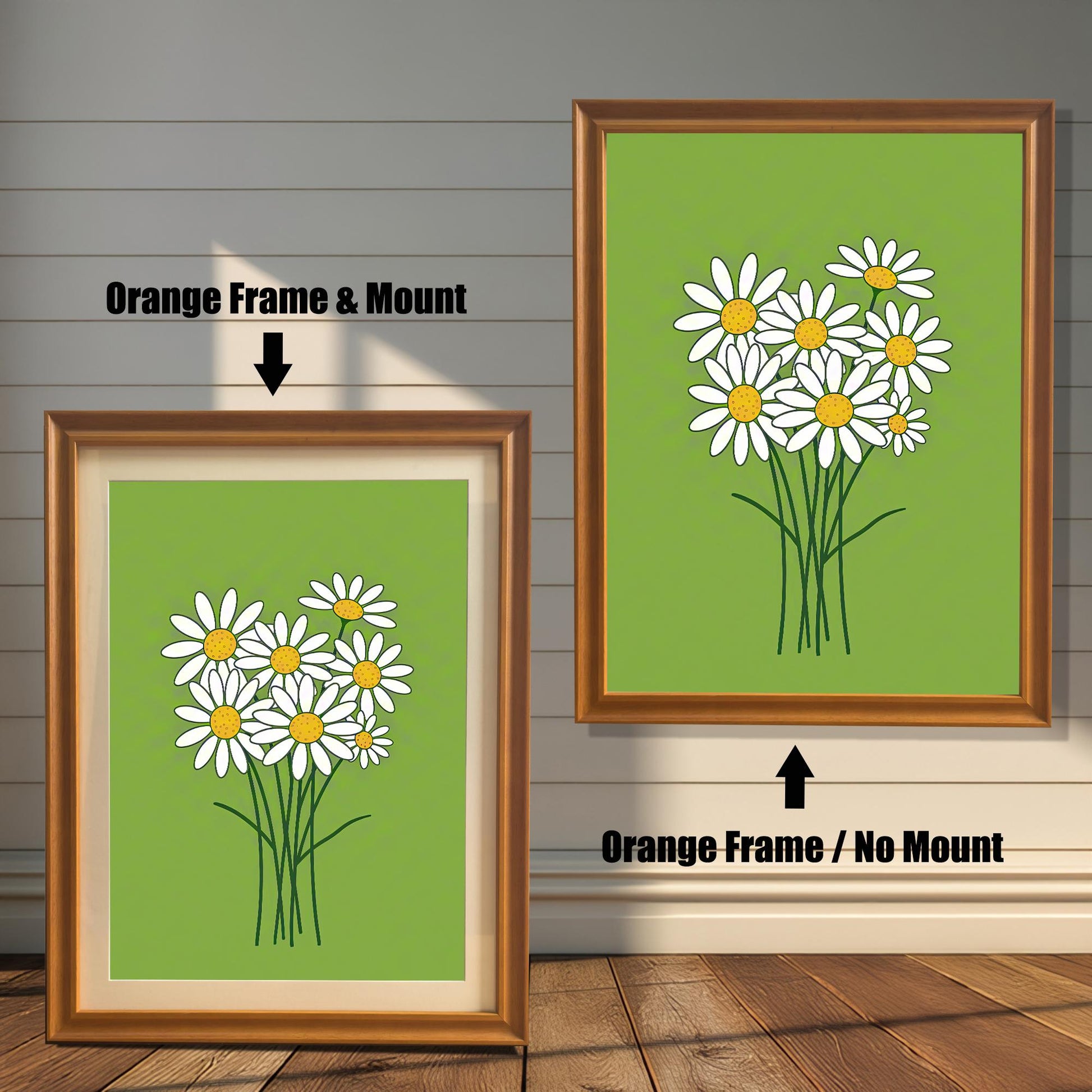 Two framed prints of a bunch of daisies on a green background. The left print has an orange frame with a mount, and the right has the same frame without a mount.