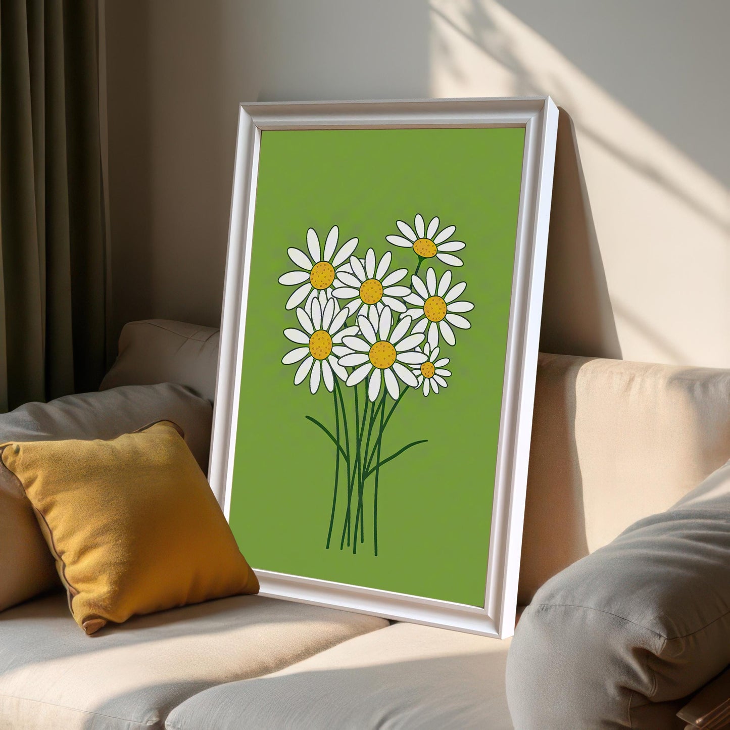 A framed print of a bunch of white daisies on a lime green background, leaning on a light-colored couch next to a yellow pillow.