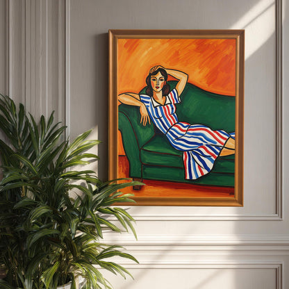 An orange-framed art print of a woman in a striped dress, propped against a light-colored wall with wainscoting. A large, leafy houseplant is in the foreground.