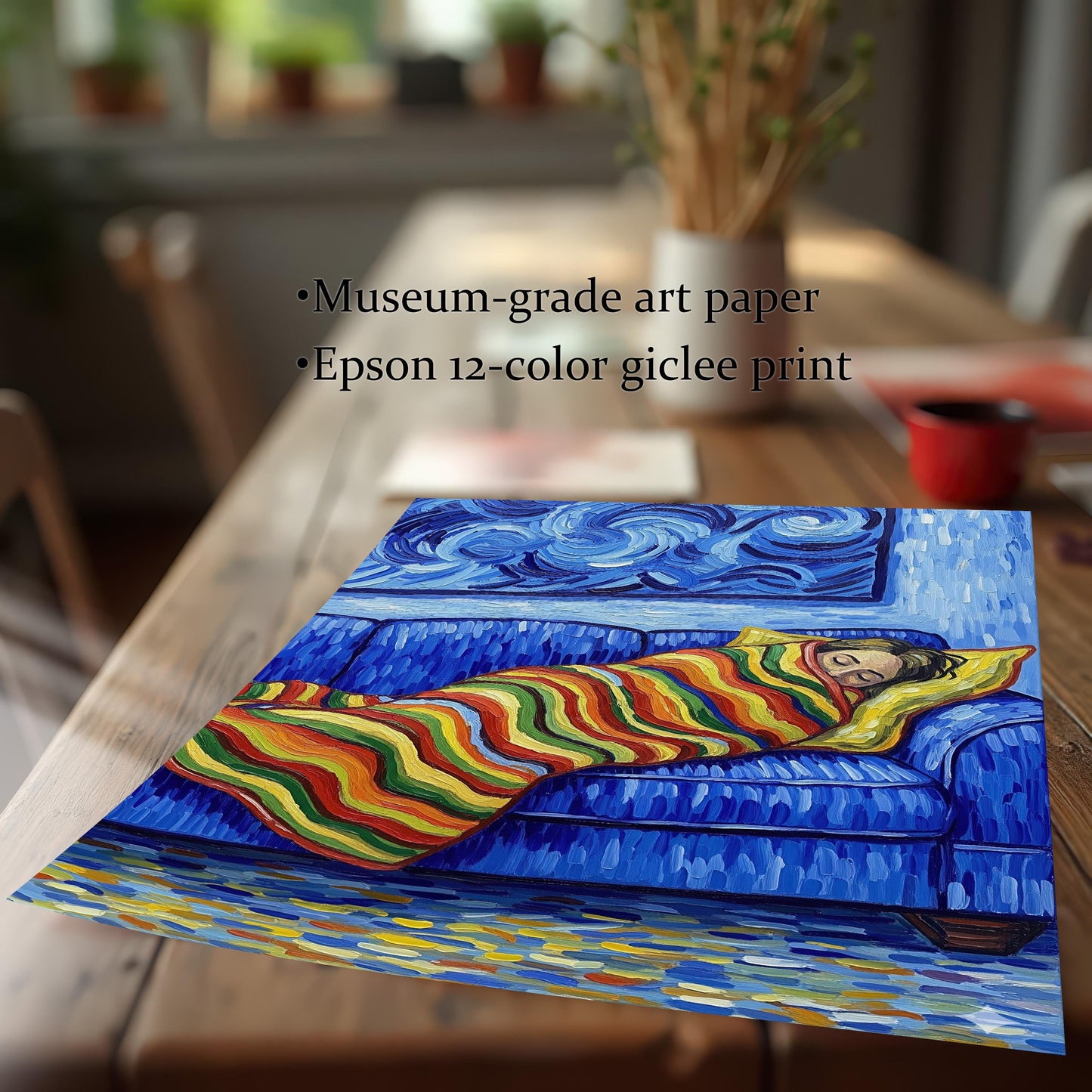 Close-up of a painting print of a person sleeping on a blue couch lying on a wooden table. The text lists features: "Museum-grade art paper" and "Epson 12-color giclee print."