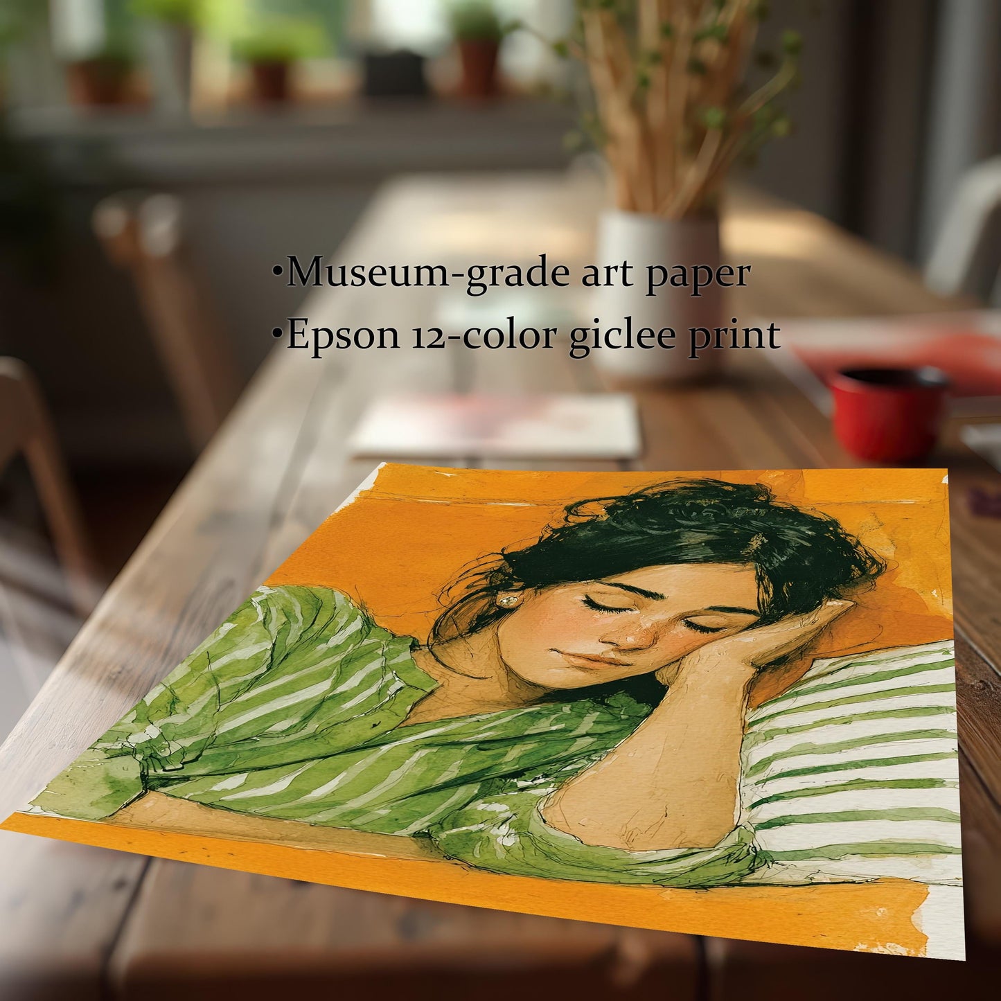 A close-up, angled shot of the unframed print of a sleeping woman, laying on a wooden table. Text on the image mentions it's a "museum-grade art paper" and "Epson 12-color giclee print."