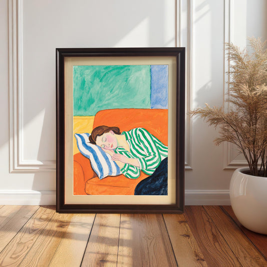 A painting of a woman sleeping on an orange sofa leans against a white paneled wall. The painting is in a dark brown wooden frame.