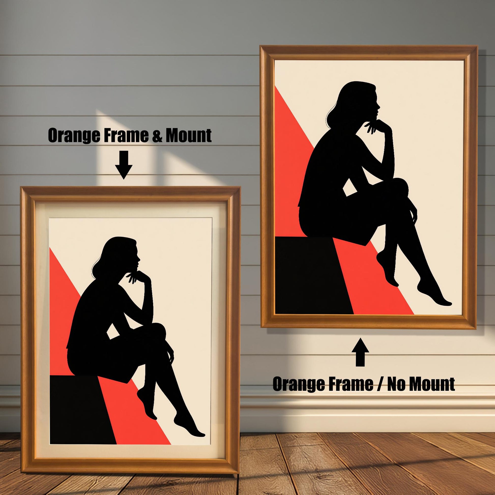 Two orange-colored framed prints are shown side by side against a paneled wall. One is labeled "Orange Frame & Mount," and the other is "Orange Frame / No Mount," showing the effect of a mat.