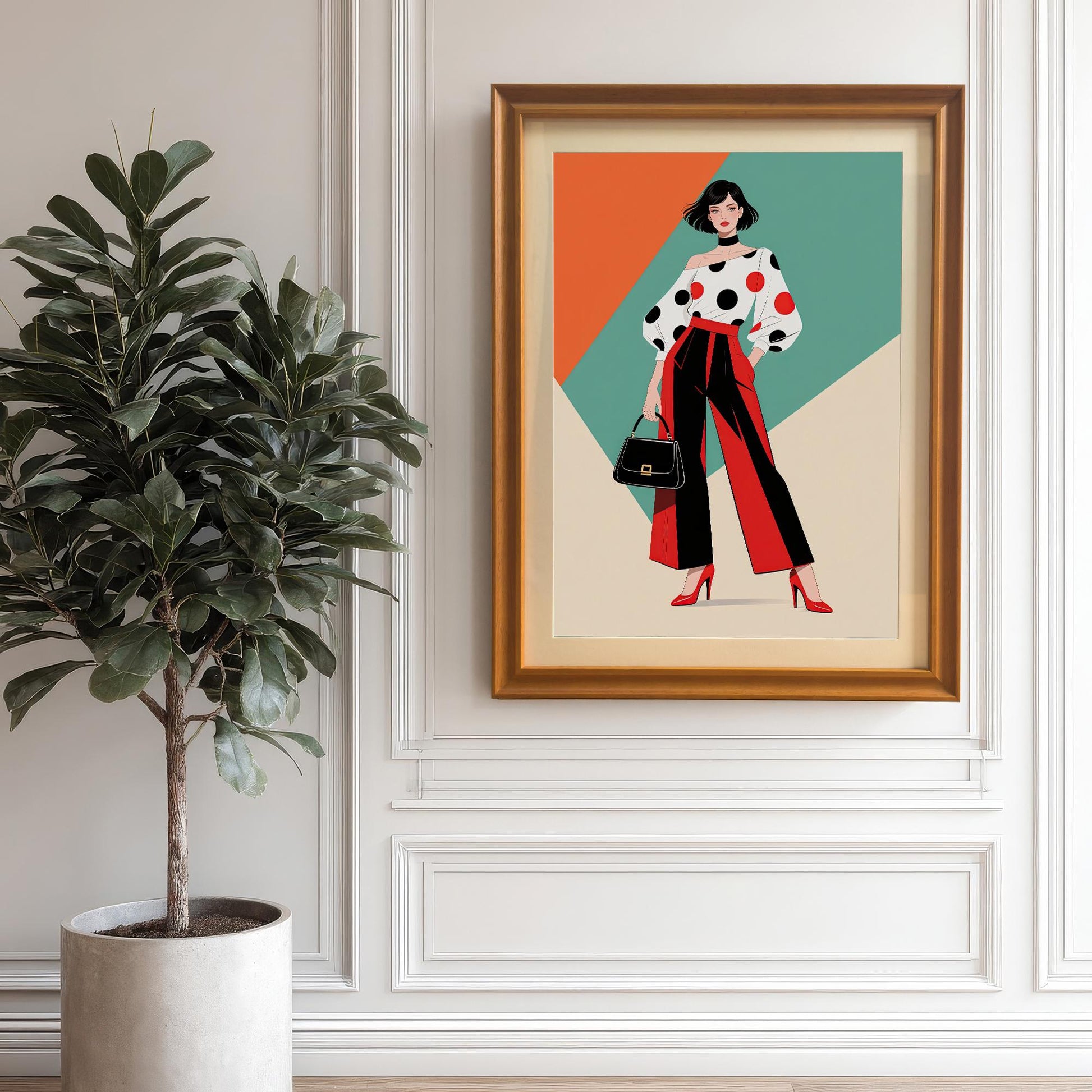 A framed art piece with a orange frame hangs on a white paneled wall. The art features a stylish woman in a polka-dot shirt and red pants. A large potted plant sits next to it.