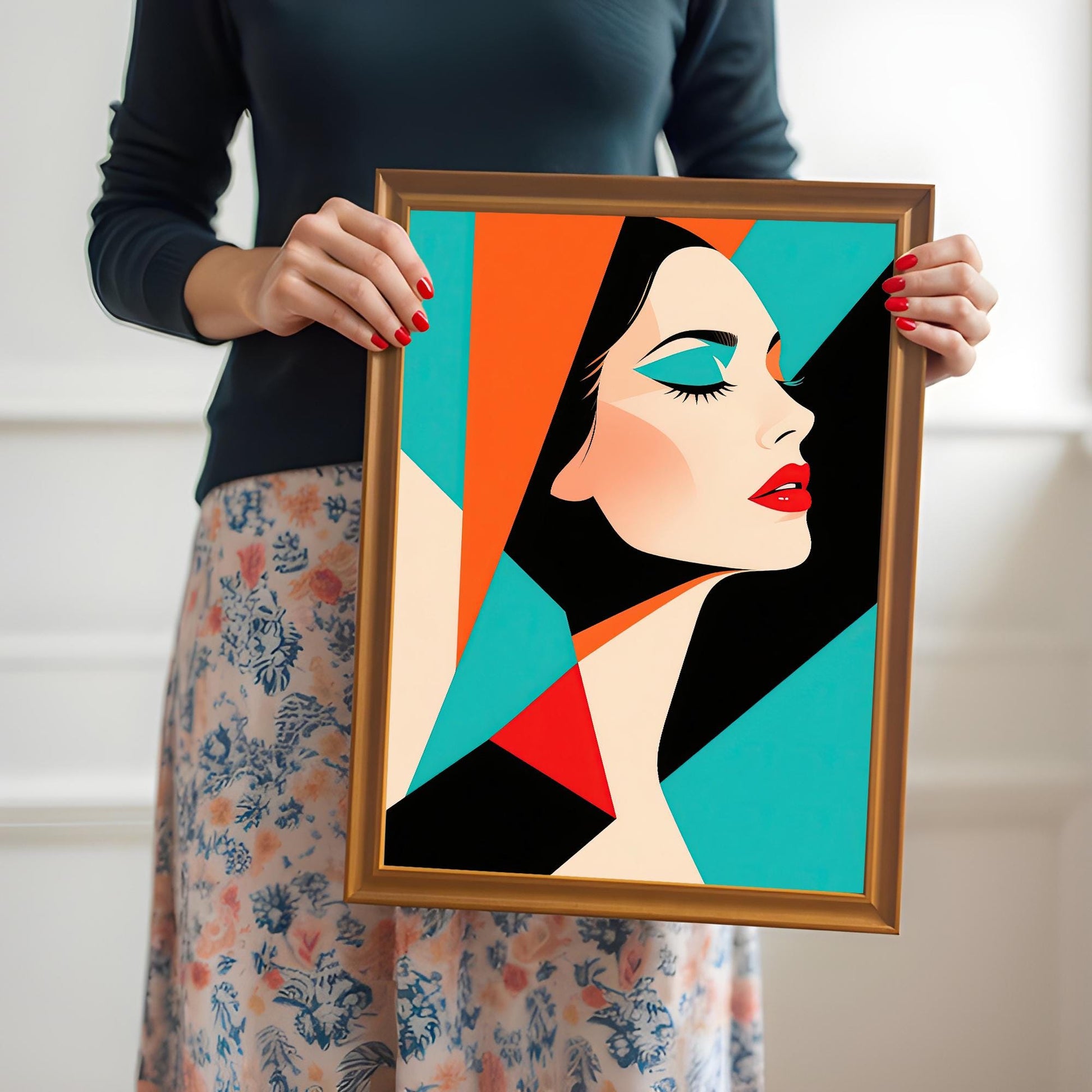 A person in a black long-sleeve shirt and a floral skirt holds an orange wood-framed print of an abstract portrait with a woman.