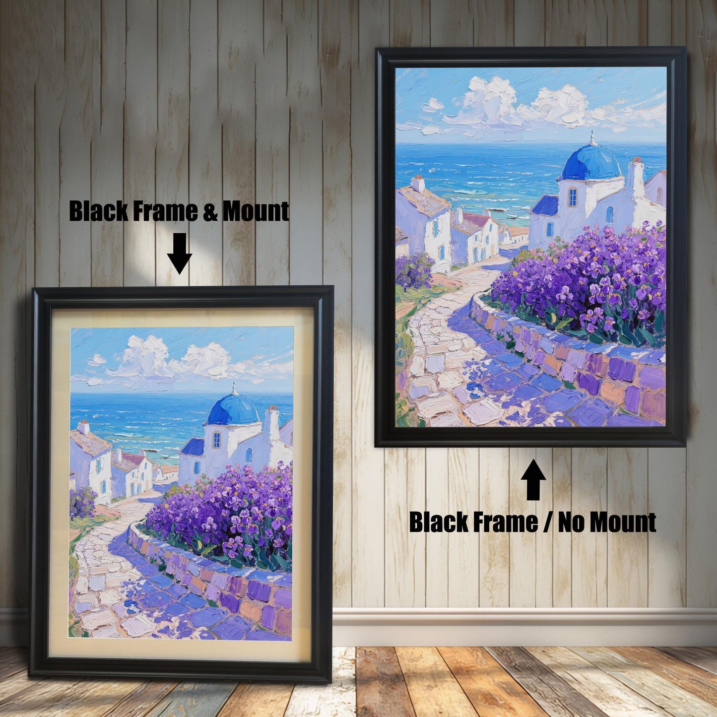 A painting of a seaside Greek village is shown in two black frames against a wood wall. One has a mount, and the other doesn't, illustrating the framing choices.