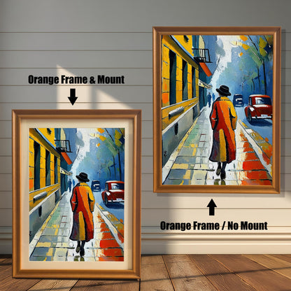 A side-by-side comparison of a framed print with a mount and without a mount. Both prints feature an impressionistic city scene and are in an orange wood-style frame. Text labels the images "Orange Frame & Mount" and "Orange Frame / No Mount."