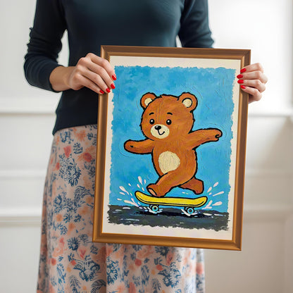A person holds up a framed print of a brown teddy bear riding a yellow skateboard on a blue background, framed in a light brown **Orange Frame**.
