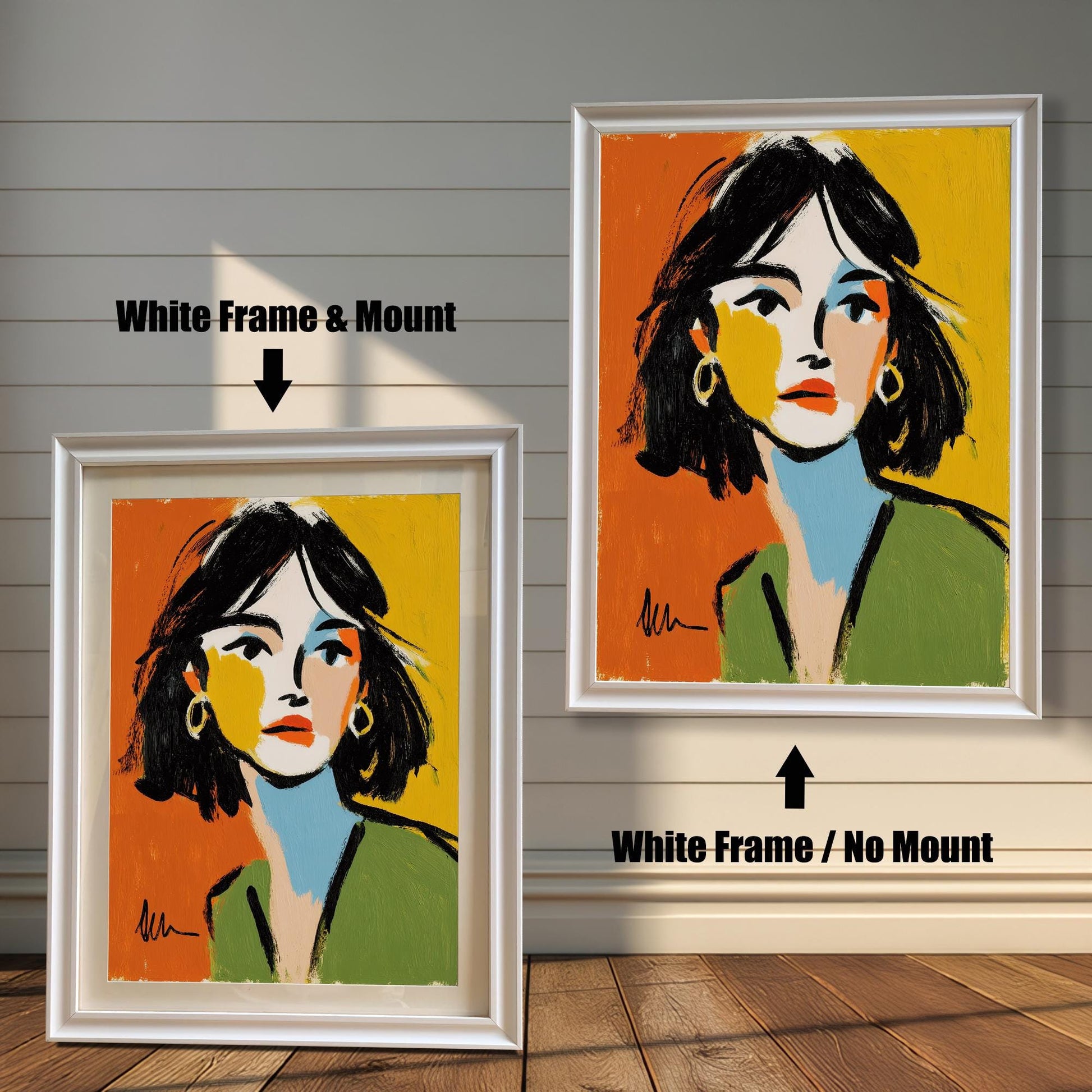 An abstract portrait of a woman is shown in two white frames against a rustic wood wall. One has a white mount, the other does not.