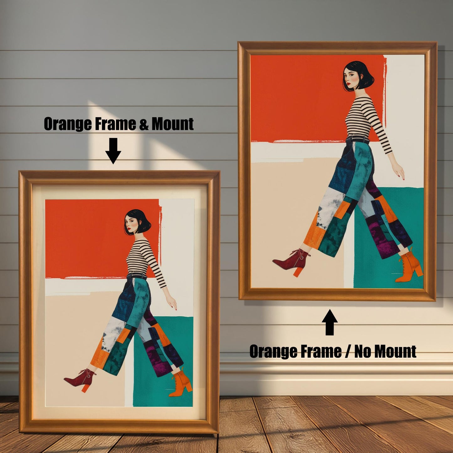 A modern art print of a woman in a striped shirt and patterned pants, shown in two orange-colored frames against a rustic wood wall. One has a mount, the other does not.