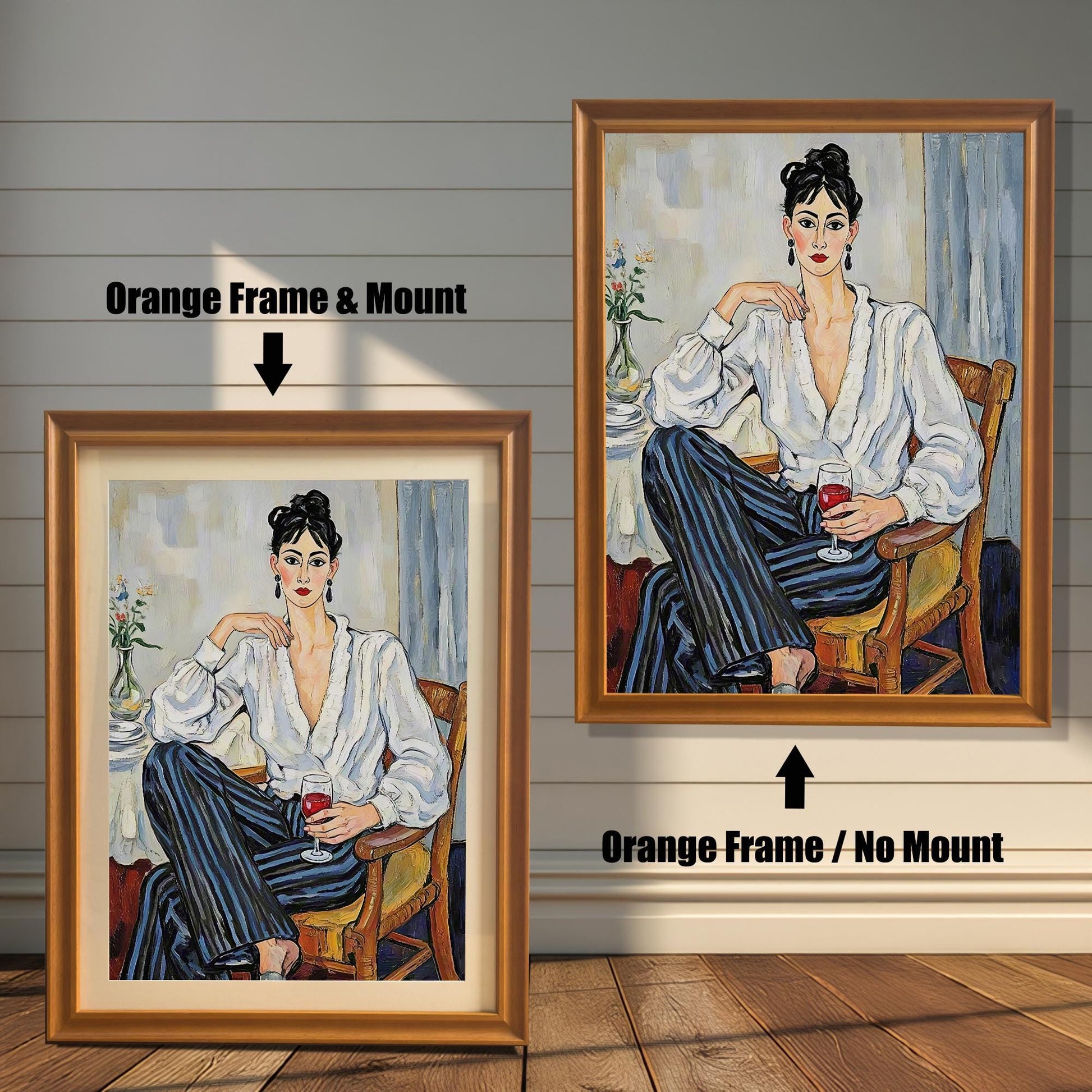 Two framed art prints on a wooden wall showing different orange frame options. One print has an **Orange Frame & Mount**, and the other has an **Orange Frame / No Mount**.