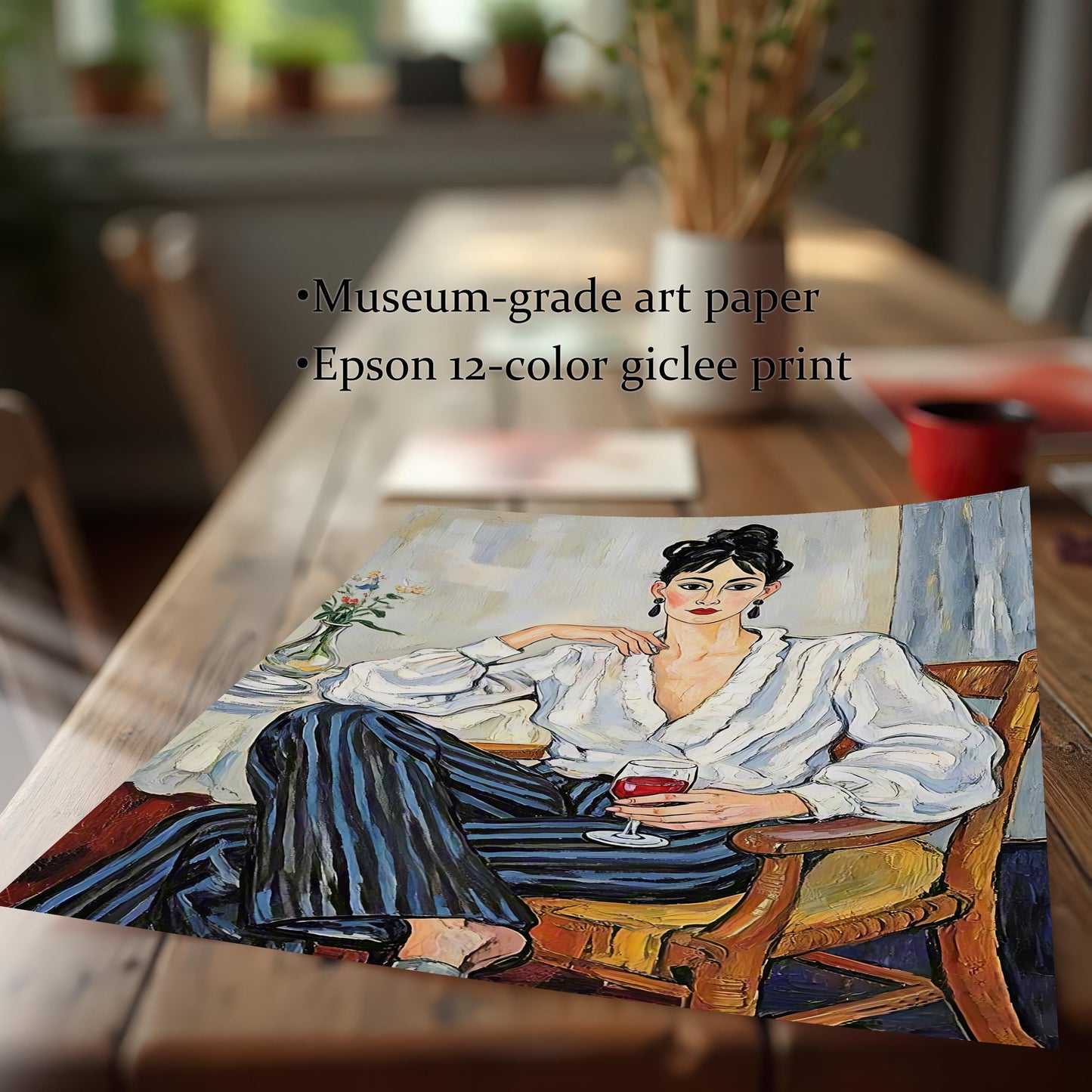 A high-quality art print of a woman in a white blouse and striped pants sitting with a glass of wine. Text on the image highlights "Museum-grade art paper" and "Epson 12-color giclee print."