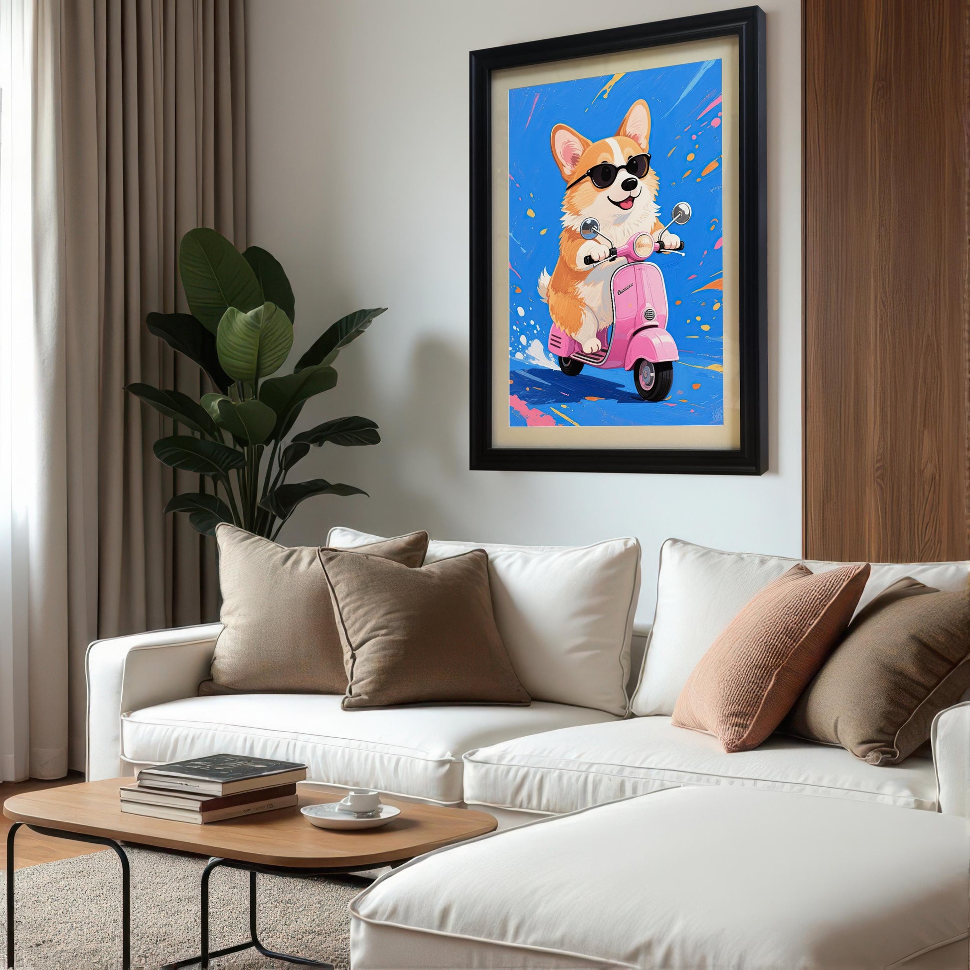 A black-framed print of a corgi on a pink scooter hanging on a white wall above a large white sectional sofa.