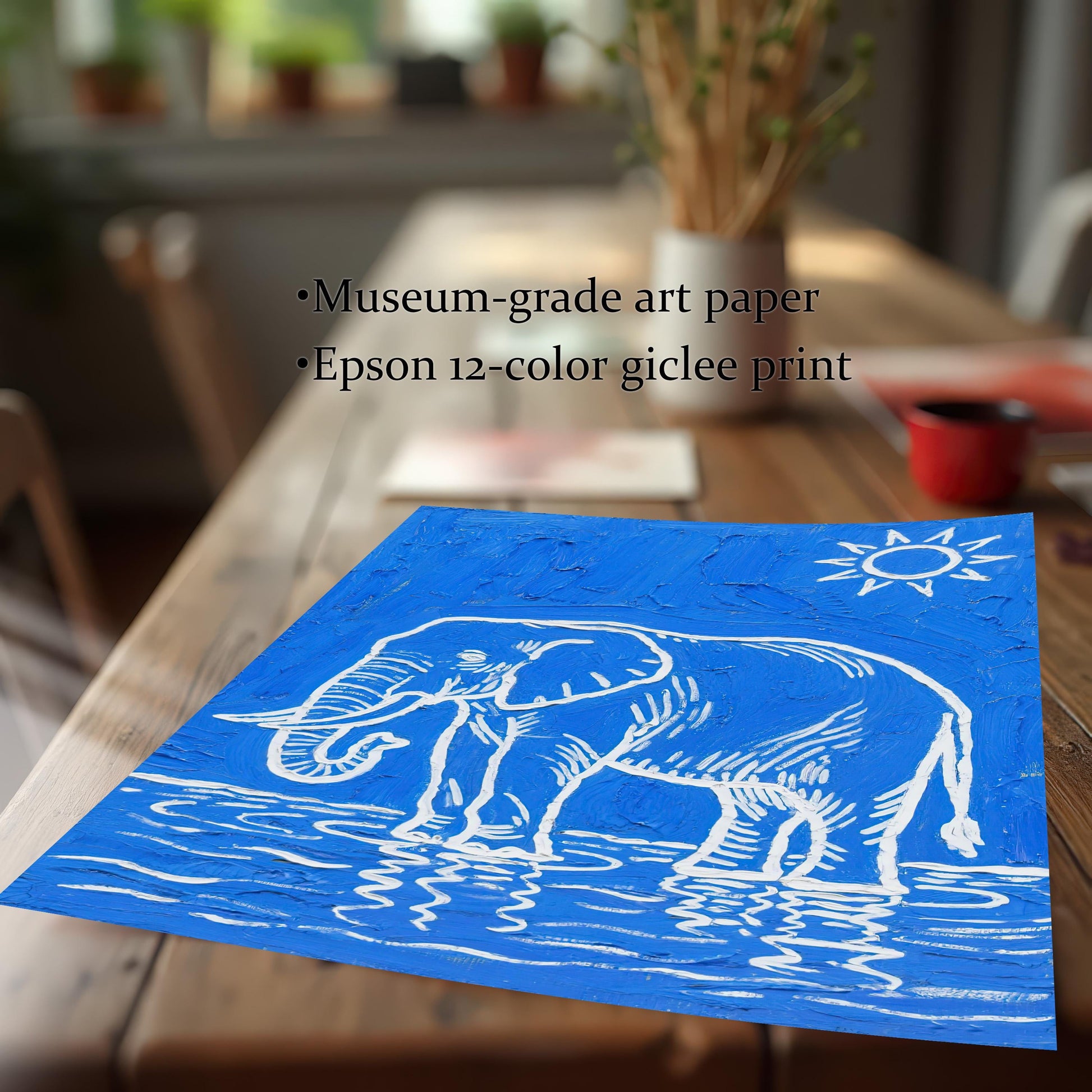 The elephant print lies on a wooden table. Text highlights "Museum-grade art paper" and "Epson 12-color giclee print."