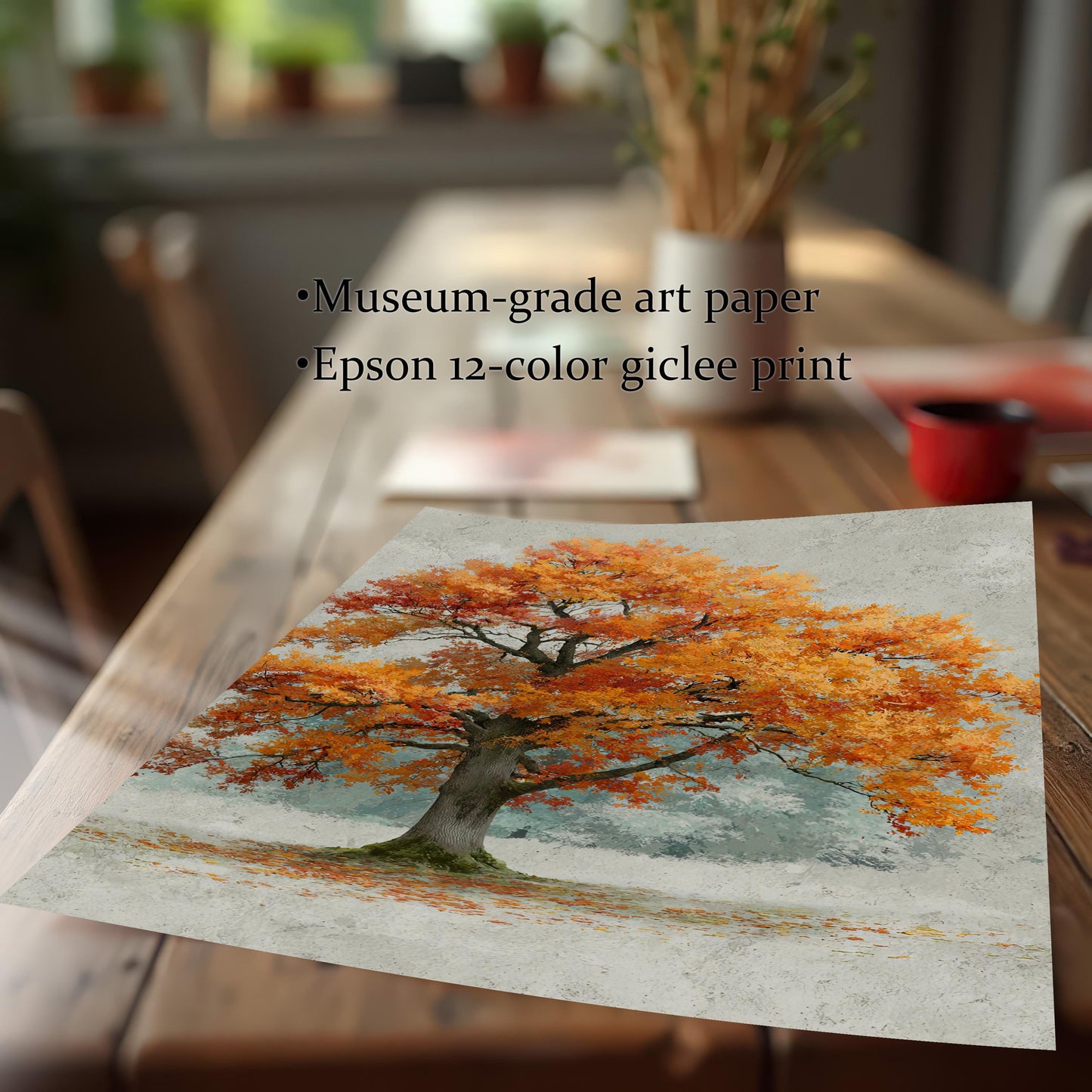 A loose art print of an autumn tree lies on a wooden table. Text on the image highlights its quality, noting "Museum-grade art paper" and "Epson 12-color giclee print."