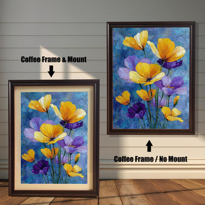 Two framed art prints of yellow and purple flowers on a wooden floor. The print on the left is in a coffee-colored frame with a mount, and the one on the right is in a coffee-colored frame without a mount.