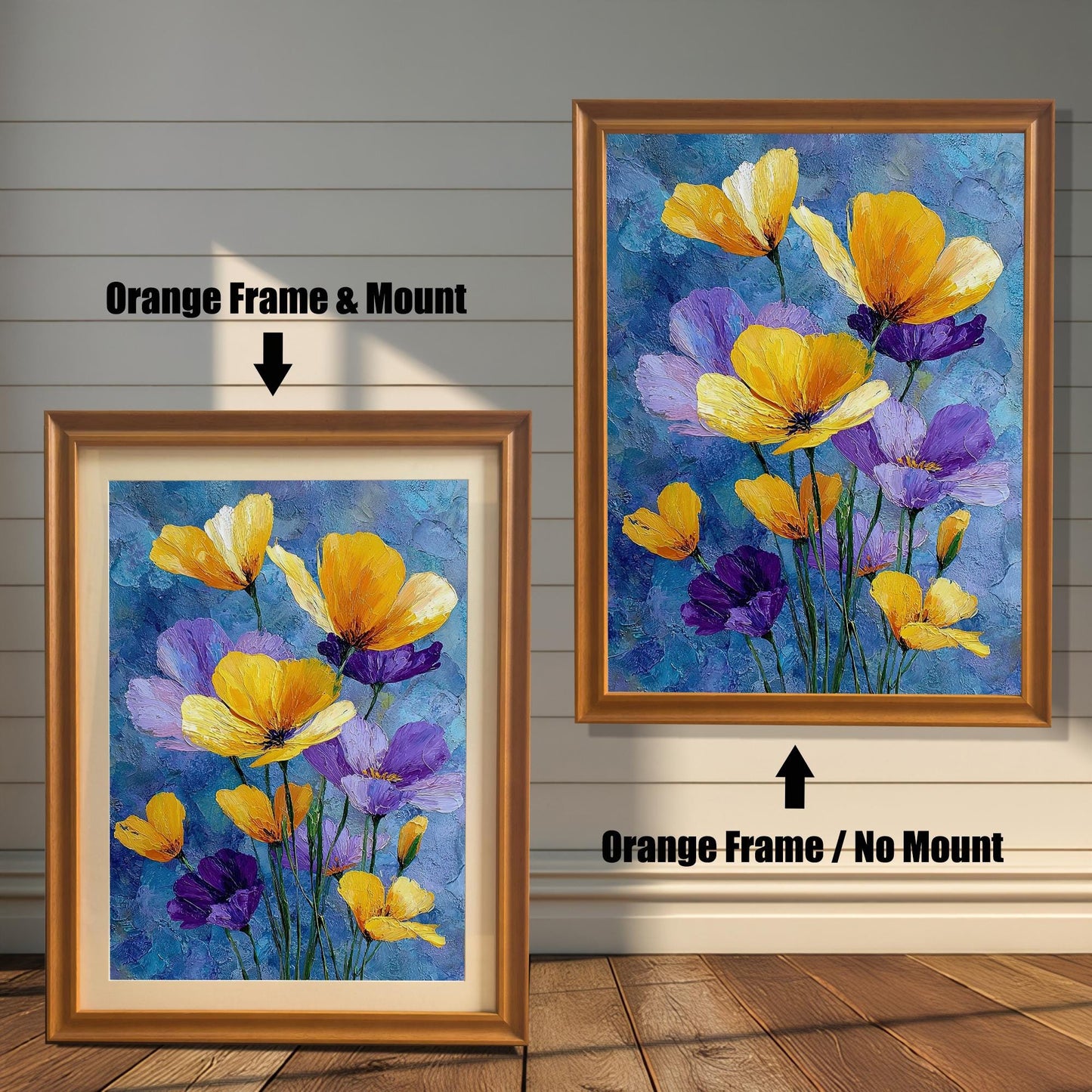 Two framed art prints of yellow and purple flowers on a wooden floor. The print on the left is in an orange frame with a mount, and the one on the right is in an orange frame without a mount.