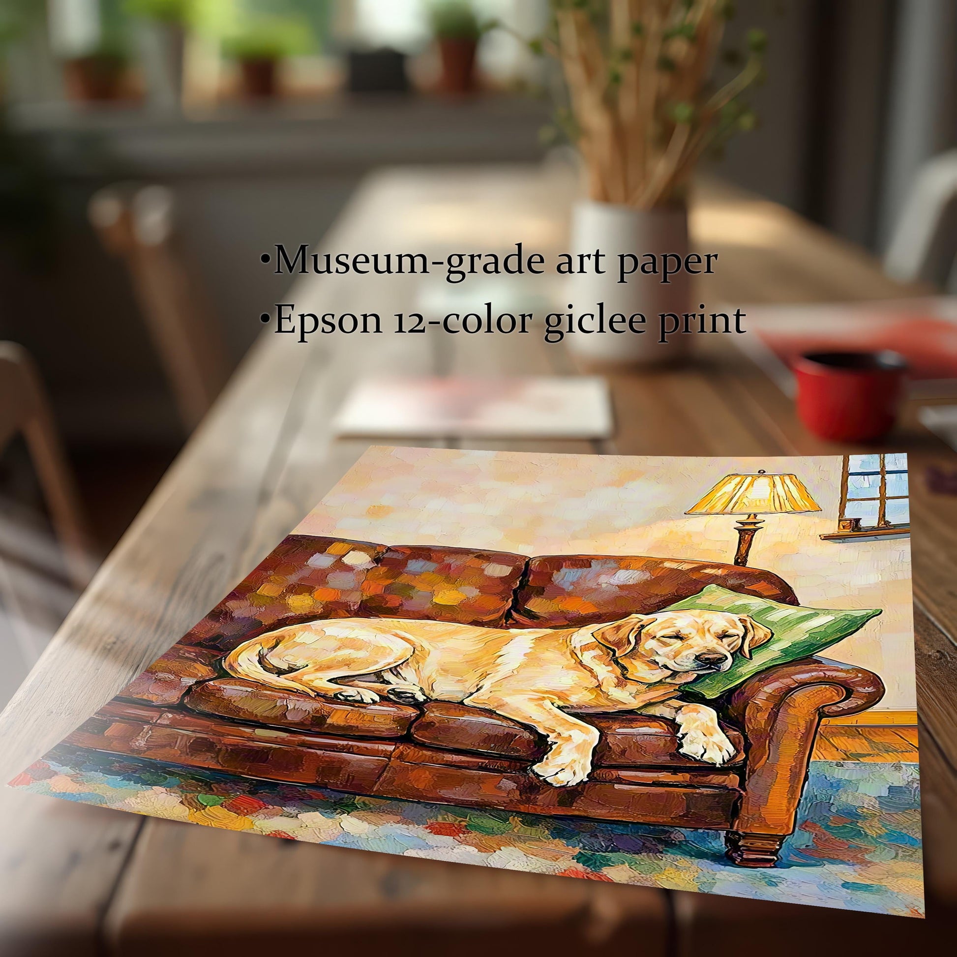 A close-up, angled shot of a print of a yellow labrador dog painting on a brown wooden table, with text describing the paper and printing method.