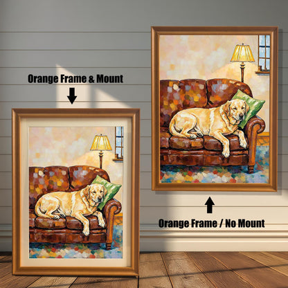 Two framed paintings of a yellow lab on a couch against a white wood wall. One has an orange frame with a white border (mount), and the other is a larger orange frame with no border.