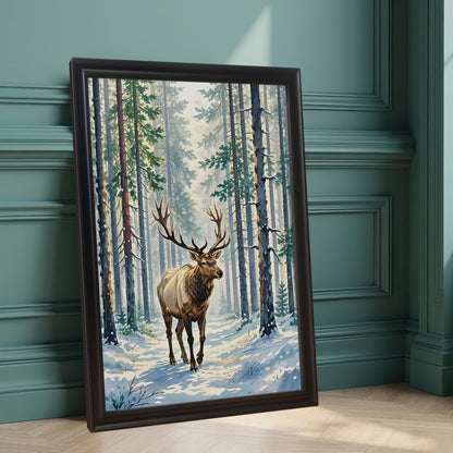 A framed painting of an elk with large antlers walking through a snowy pine forest. The black-framed art leans on a light wood floor against a teal wall.