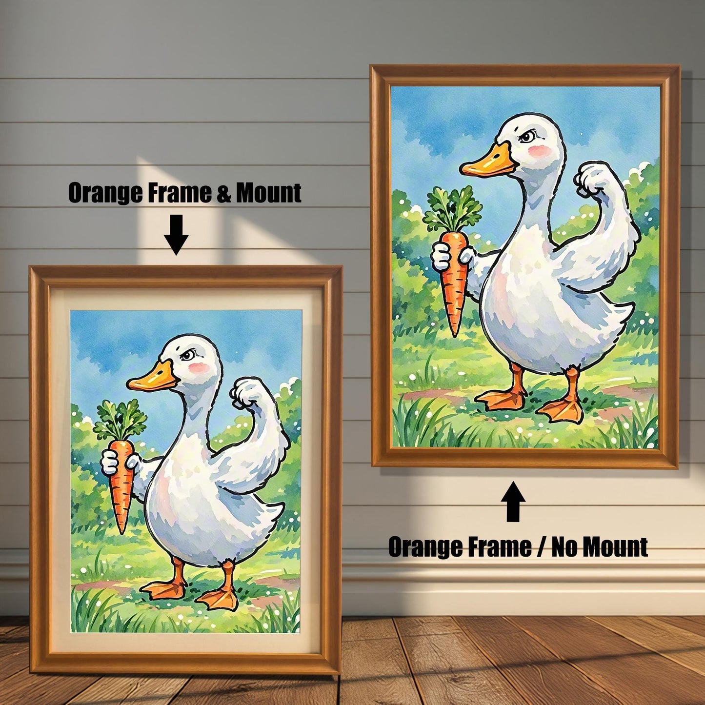 Two framed art prints of a duck with a carrot. The image on the left has an orange frame with a white mount, while the one on the right has an orange frame with no mount.