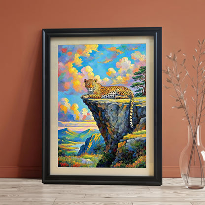 Framed wall art of a leopard on a cliffside, leaning against a reddish-brown wall with a vase of dried plants.