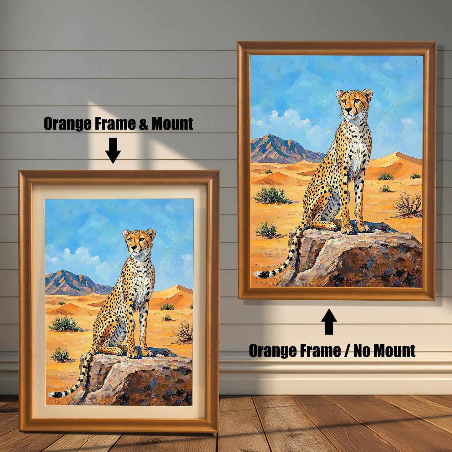 Two framed paintings of a cheetah in a desert. The left one has an orange frame with a mount, and the right one has an orange frame with no mount.