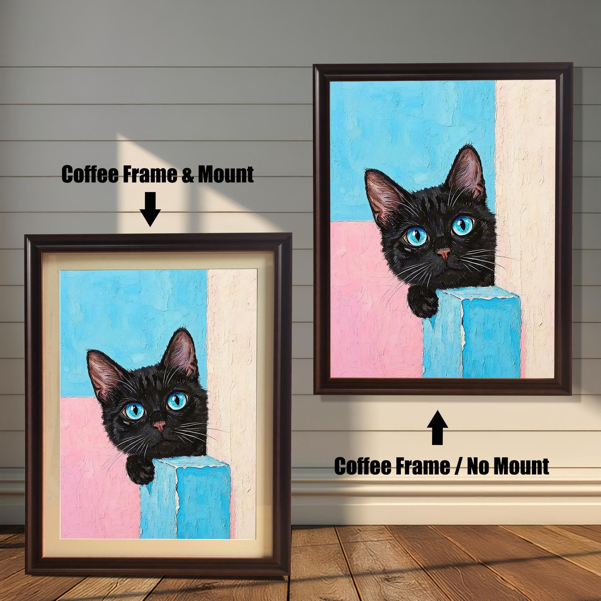 Two framed prints of a black cat with blue eyes on a wood paneled wall. One has an coffee frame with a mount, and the other is the same frame without a mount.