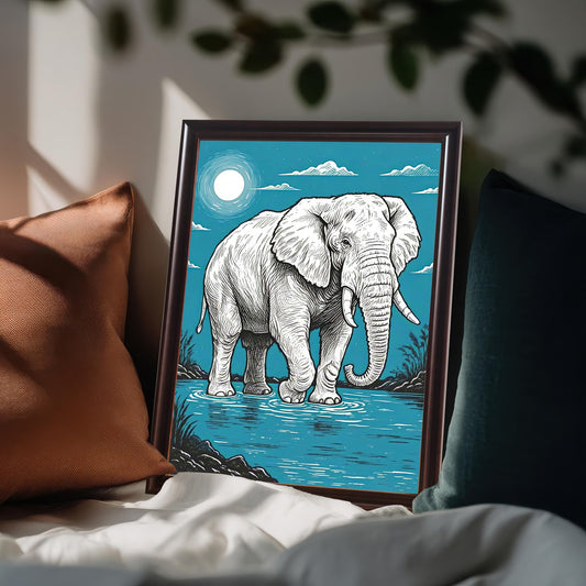 A framed painting of an elephant standing in water, with a full moon in a blue sky. The frame is brown and the art is propped on a bed with pillows.
