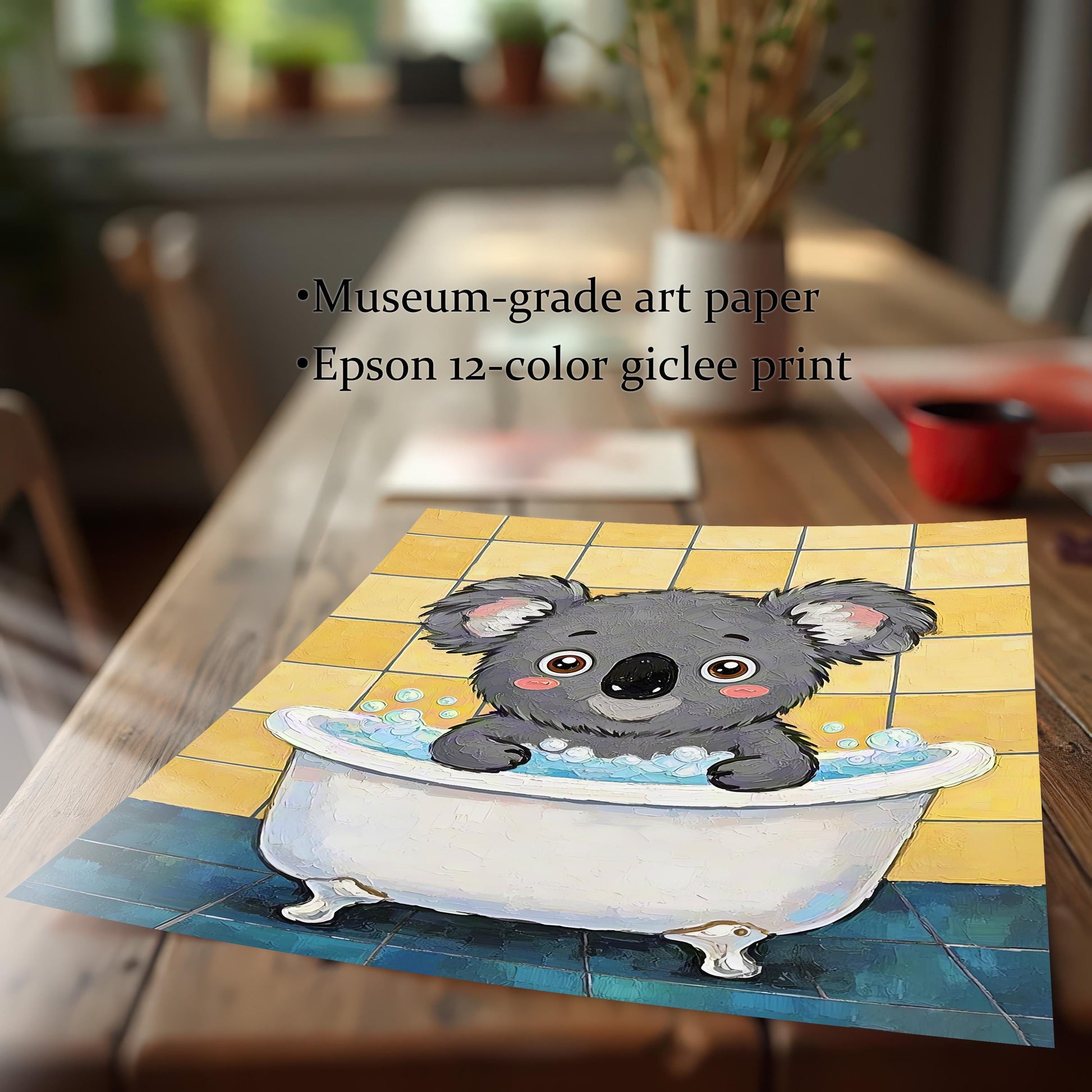 A loose, unframed art print of a koala in a bathtub, laying on a wooden dining table. Text highlights the use of museum-grade art paper and an Epson 12-color giclee print.