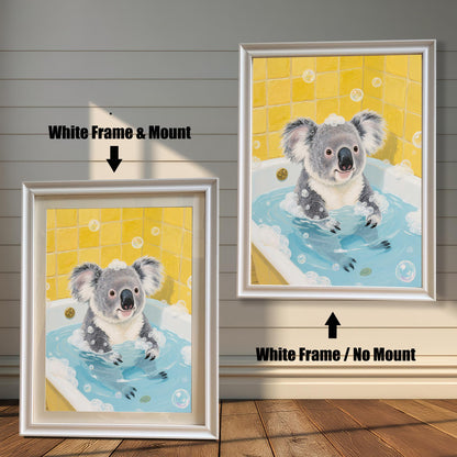 A side-by-side comparison of two framed prints of a koala in a bathtub. Both prints have a white frame, but one includes a white mount, while the other does not.