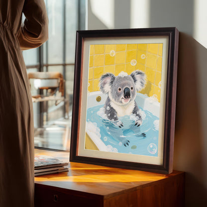 A framed print of a koala in a bathtub propped up on a wooden dresser next to a large window. A person in a light brown dress is standing in the background.