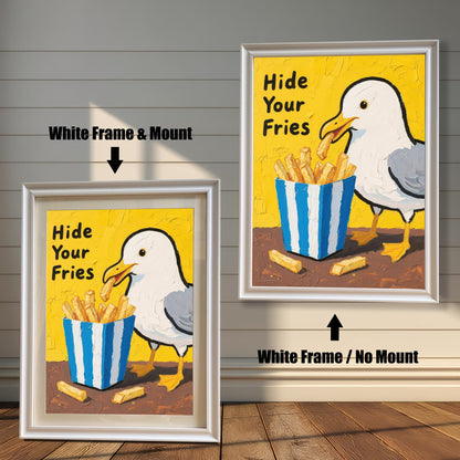A side-by-side comparison of two framed prints of a seagull and fries. Both prints have a white frame, but one includes a mount, while the other does not.