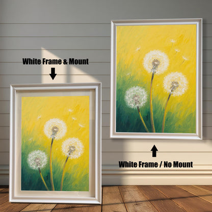 Two framed dandelion art prints on a wood paneled wall. One has a white frame with a mount, and the other is the same frame without a mount.
