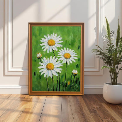 An upright, framed daisy print with an orange-colored frame leaning against a white wall next to a potted snake plant.