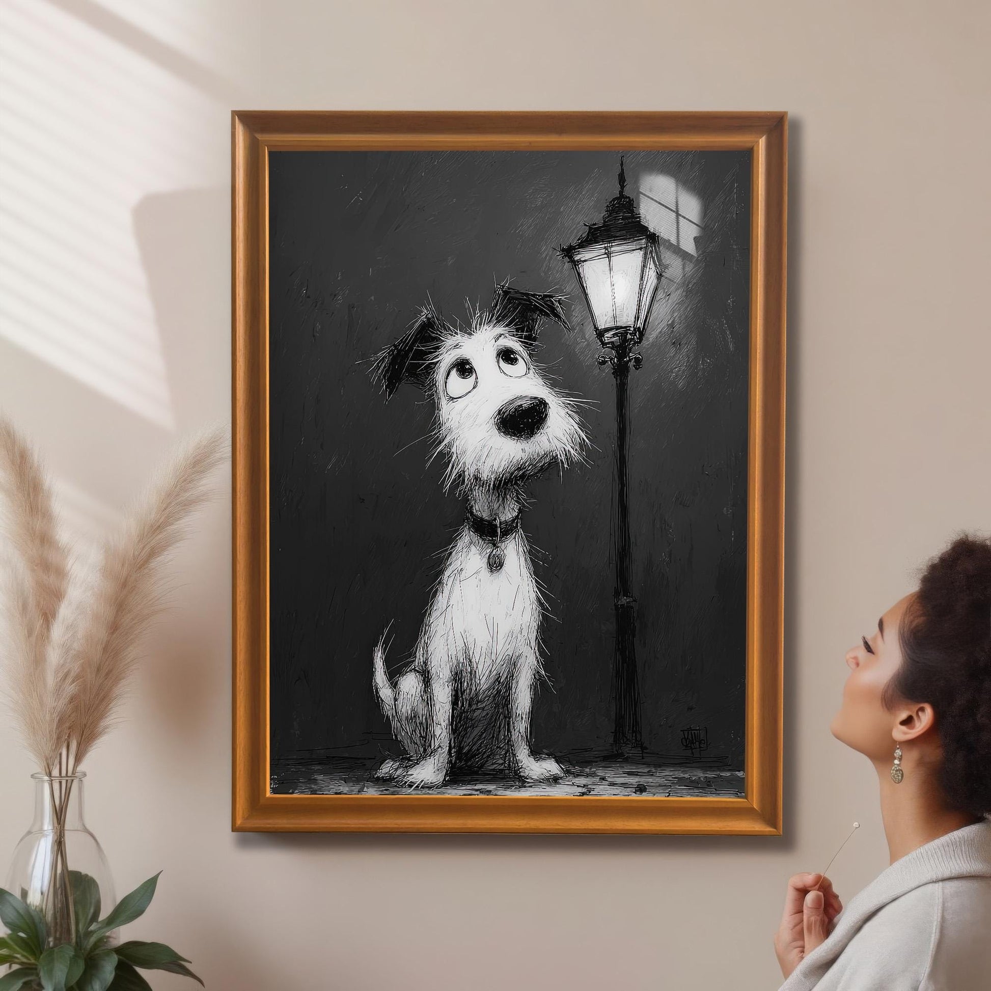 A black and white painting of a fluffy dog looking up at a street lamp in an "orange" colored frame, hung on a light-colored wall. A person is looking at the art.
