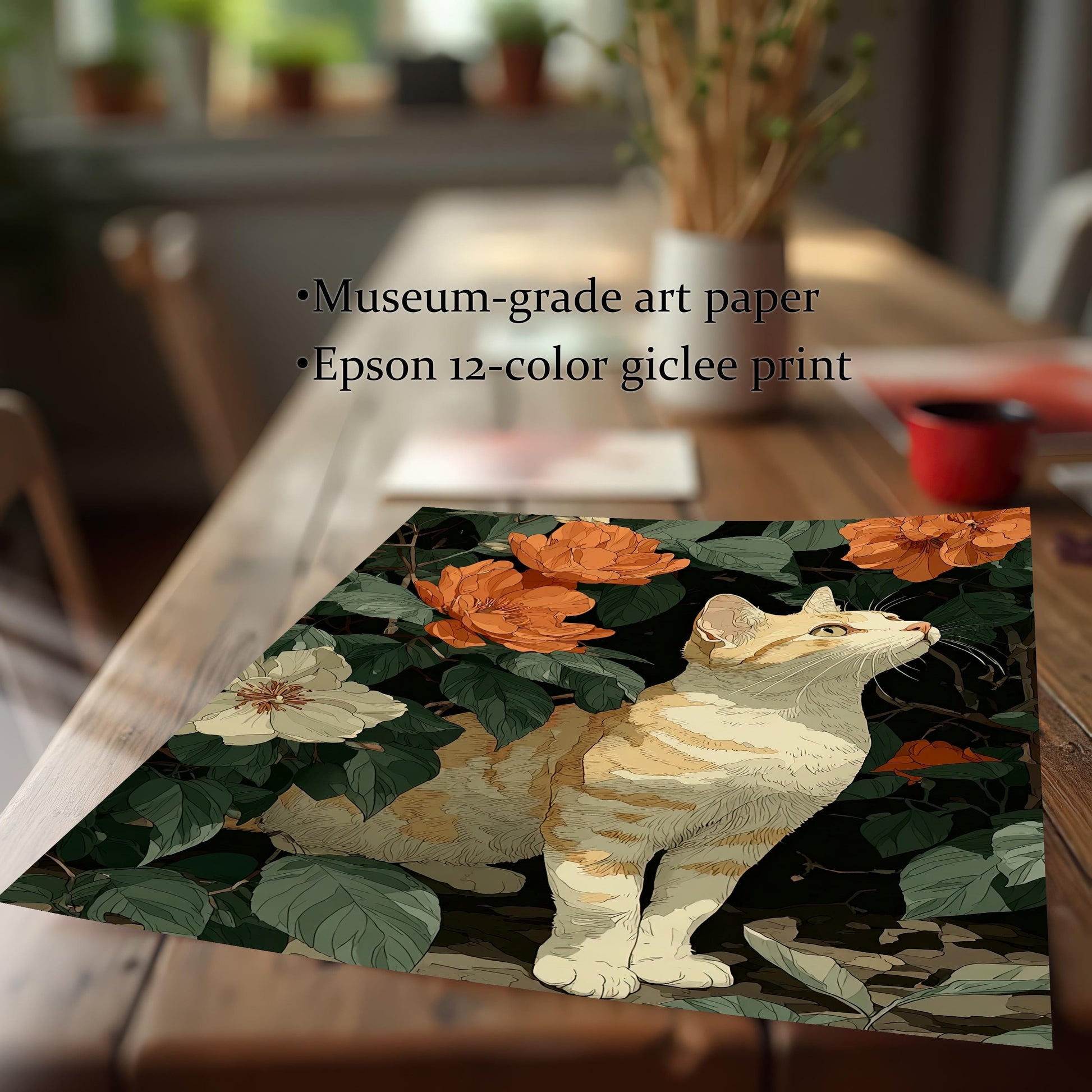 Close-up of a framed art print featuring a ginger and white cat among orange and white flowers and dark green foliage, resting on a wooden table. Text lists "Museum-grade art paper" and "Epson 12-color giclee print."