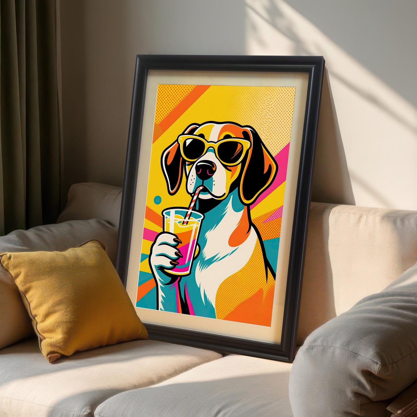 A black-framed pop art beagle print leans against a couch, with a yellow pillow in the foreground.