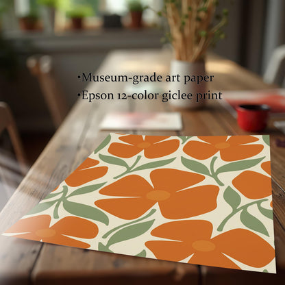 A flat art print with a repeating pattern of orange flowers and green leaves on a wooden table, with text describing it as "museum-grade art paper" and an "Epson 12-color giclee print."