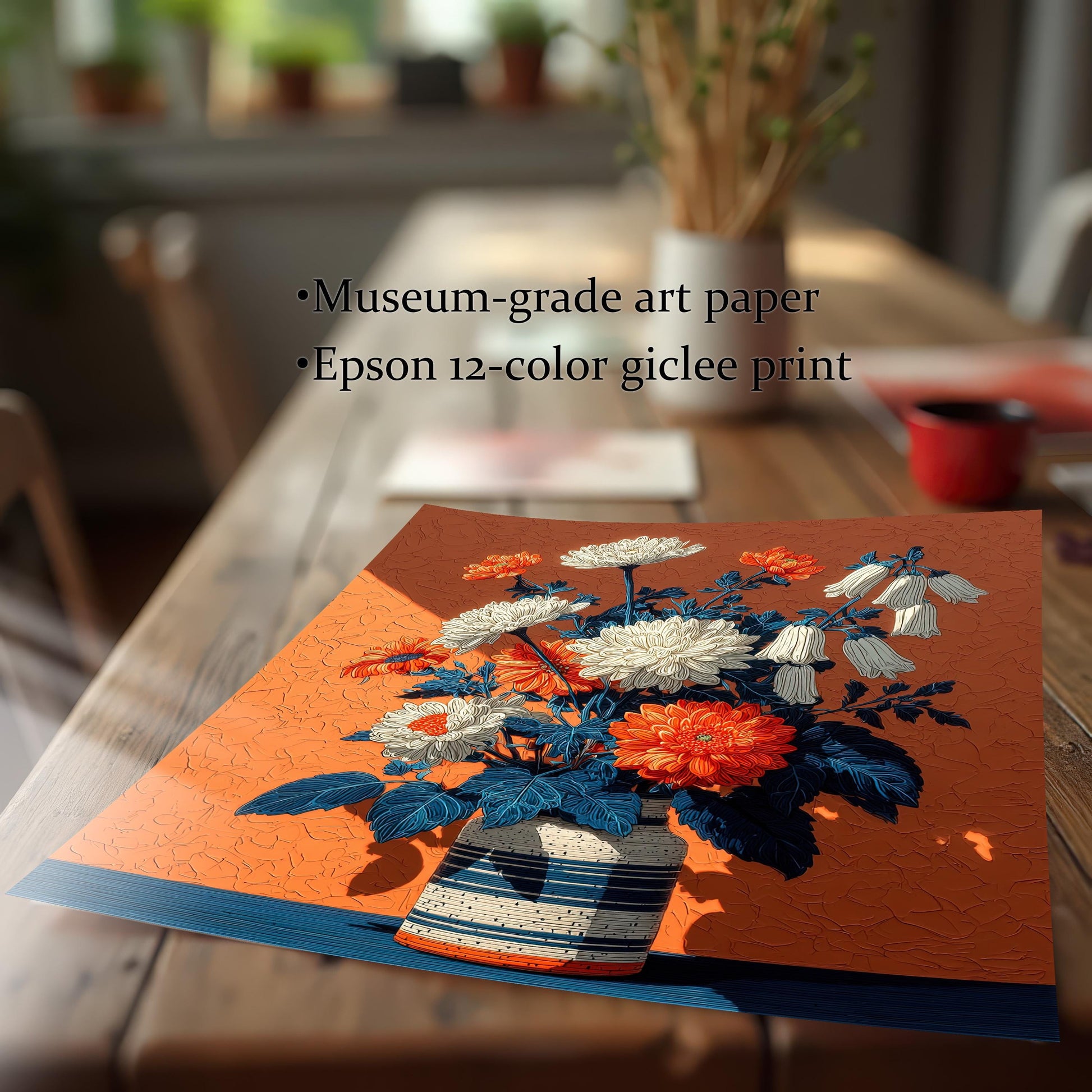 A flat art print of a floral arrangement on an orange background on a wooden table, with text describing it as a "museum-grade art paper" and "Epson 12-color giclee print."