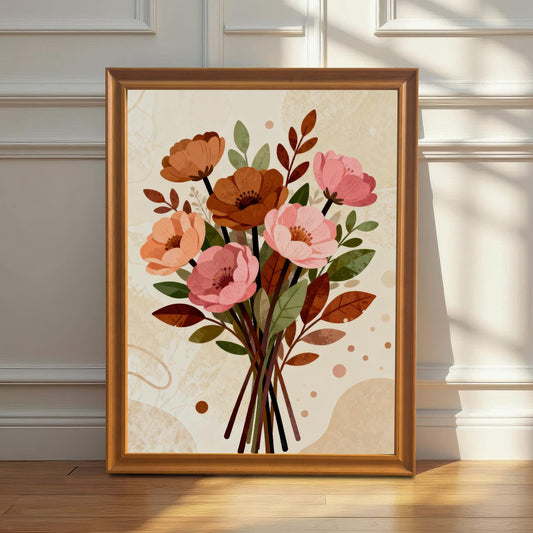 A framed floral art print in an orange frame leaning against a white wainscoted wall. Sunlight streams across the print and the hardwood floor.