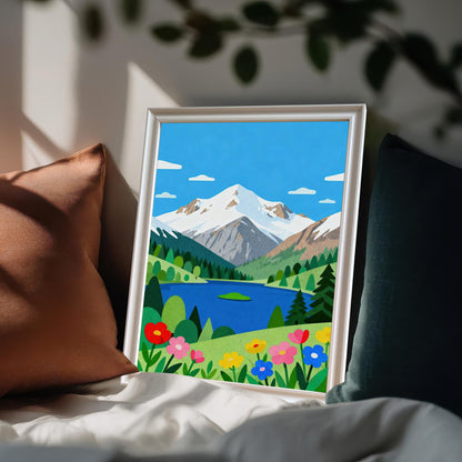 A framed folk art print of a mountain lake and snowy peaks leans against brown and dark green pillows on a white duvet cover.