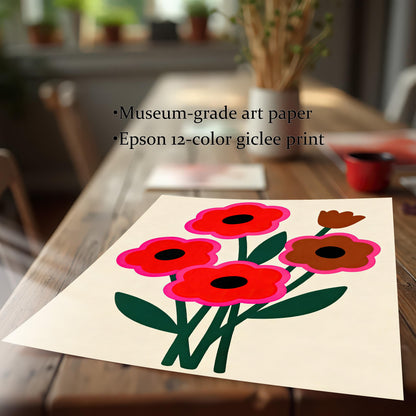 A flat lay of an unframed abstract floral print with red and brown flowers sits on a long wooden dining table.