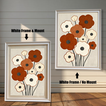 Two framed abstract floral paintings with brown and white flowers and a white frame. One has a white matting, and the other does not.