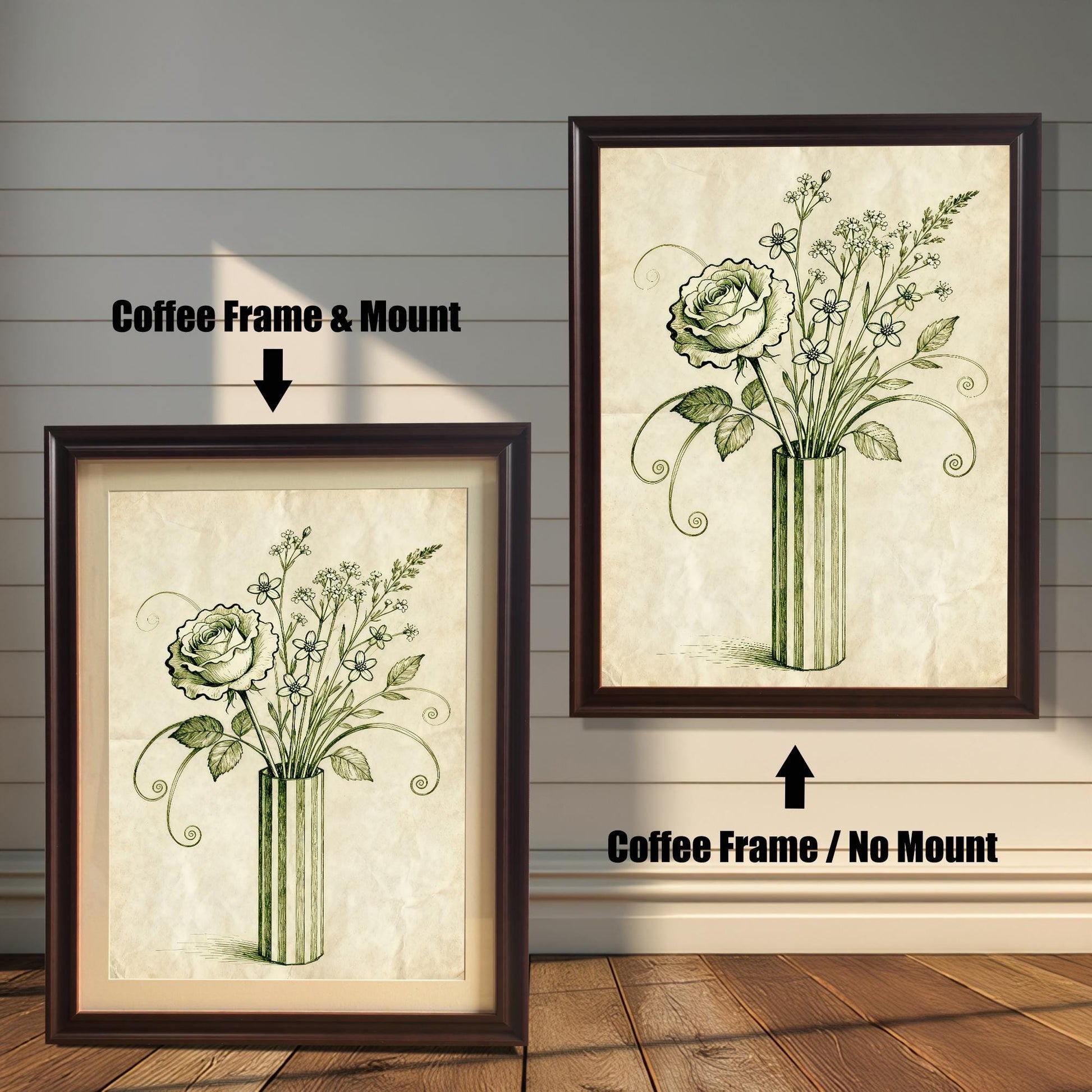 A framed art print of a vintage-style rose and flowers in a vase is shown in two styles against a wooden wall. One has a coffee-colored frame with a white mount, the other is a larger size with the same frame, but no mount.
