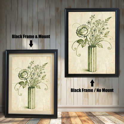 A framed art print of a vintage-style rose and flowers in a vase is shown in two styles against a wooden wall. One has a black frame with a white mount, the other is a larger size with the same frame, but no mount.